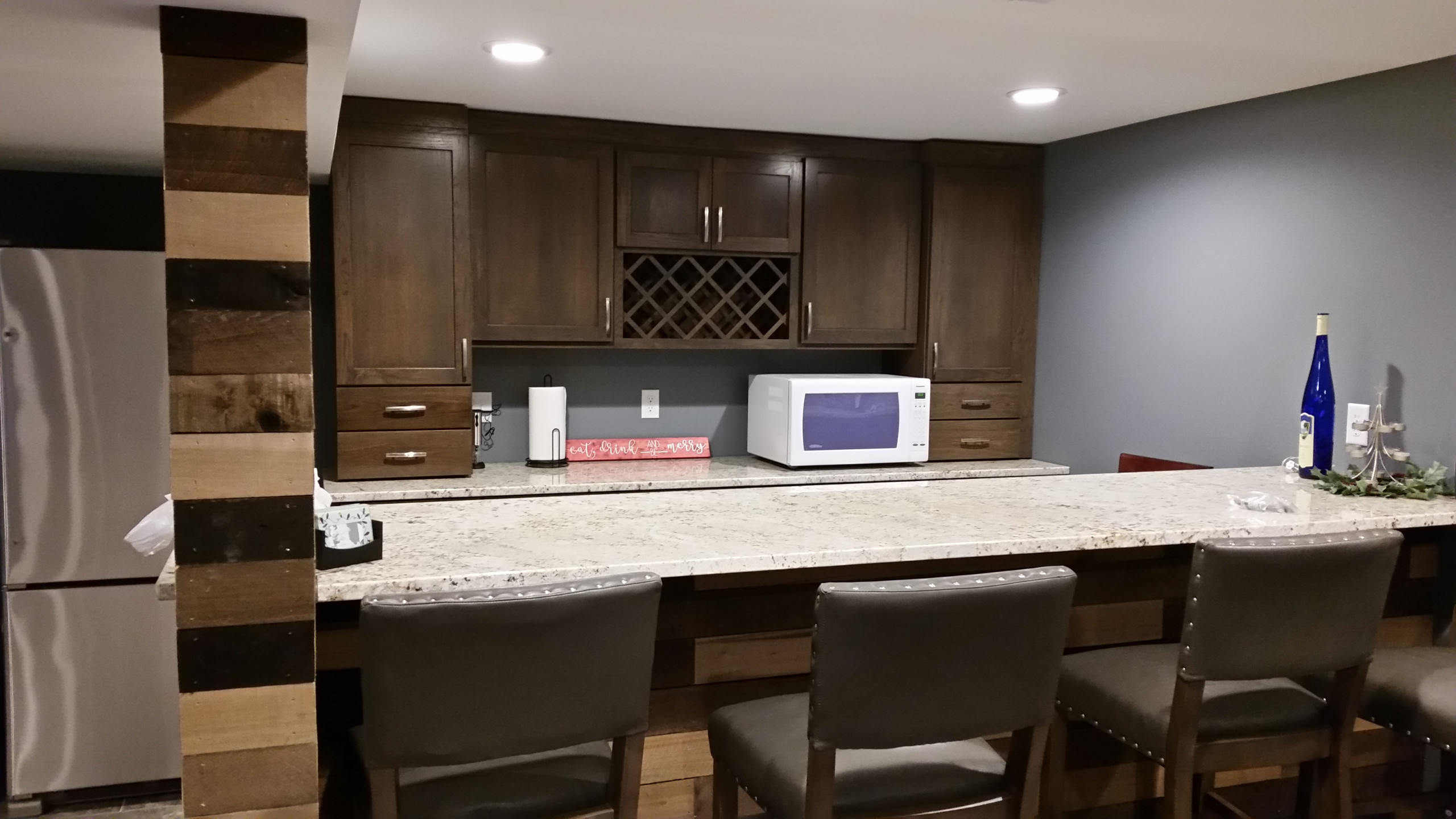 Basement rec room with custom bar and bedroom
