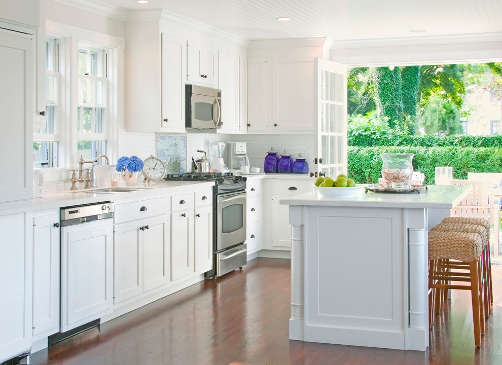 Traditional kitchen in Boston with shaker cabinets and panelled appliances.