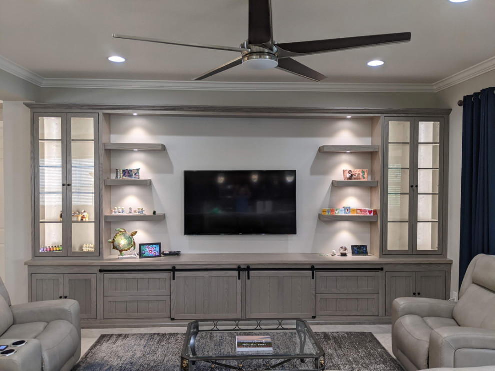 Photo of a transitional living room in Tampa with a wall-mounted tv.