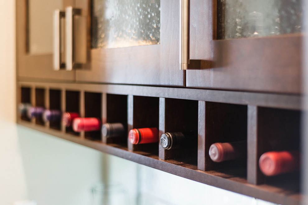 Example of a transitional home design design in Denver