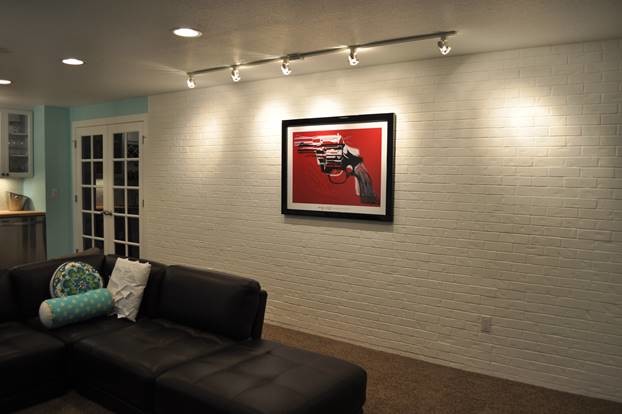 Example of a mid-sized transitional underground carpeted basement design in Denver with blue walls