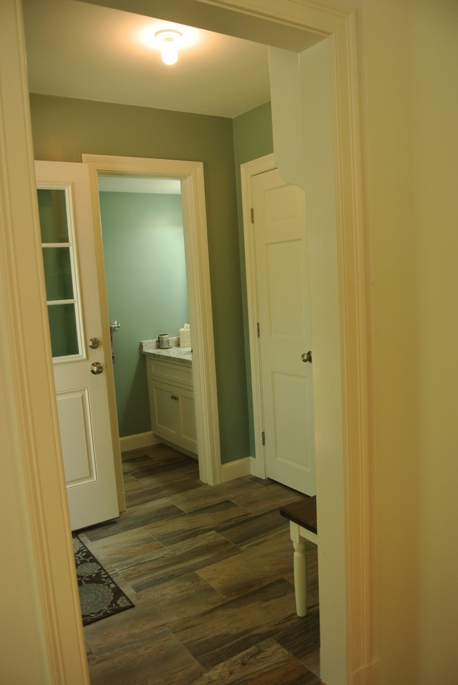 Transitional light wood floor eat-in kitchen photo in Boston with an undermount sink, shaker cabinets, granite countertops, white backsplash, subway tile backsplash, stainless steel appliances and an island