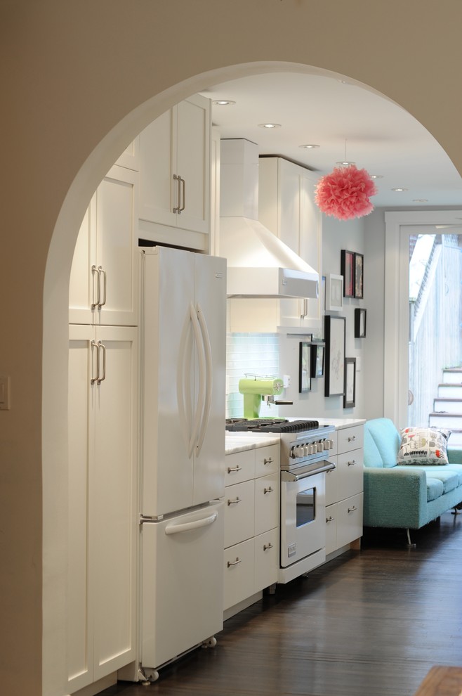 Inspiration for an eclectic kitchen in DC Metro with white appliances.