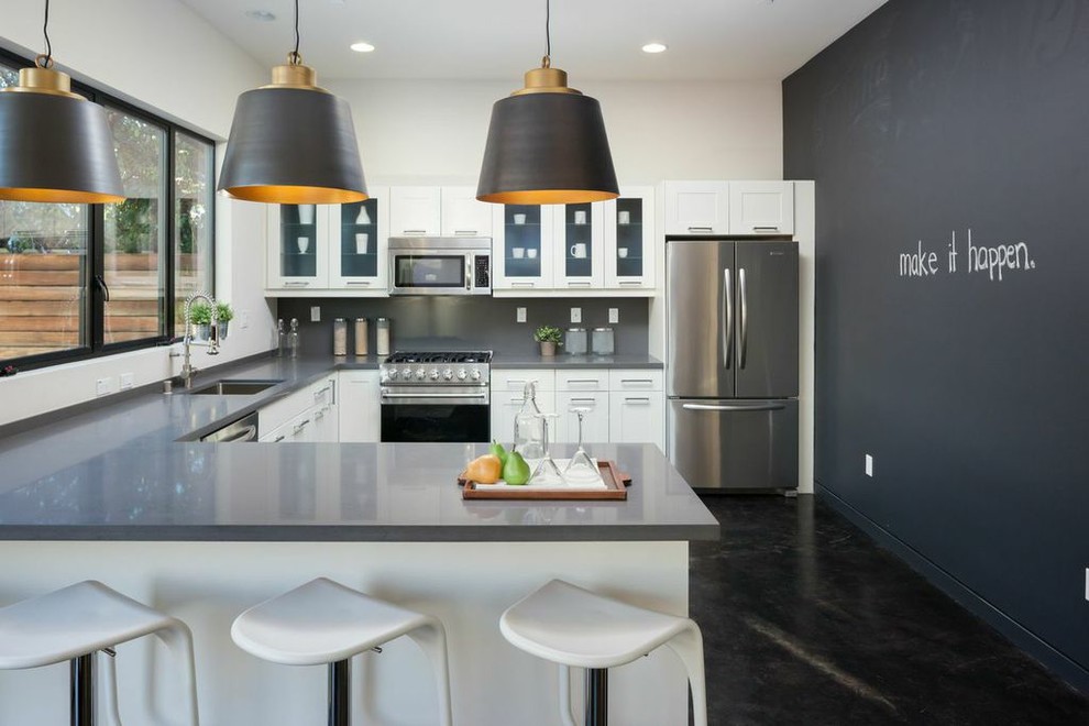Inspiration for a transitional l-shaped kitchen in San Francisco with an undermount sink, stainless steel appliances, shaker cabinets and white cabinets.