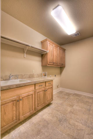 Design ideas for a traditional laundry room in Austin.