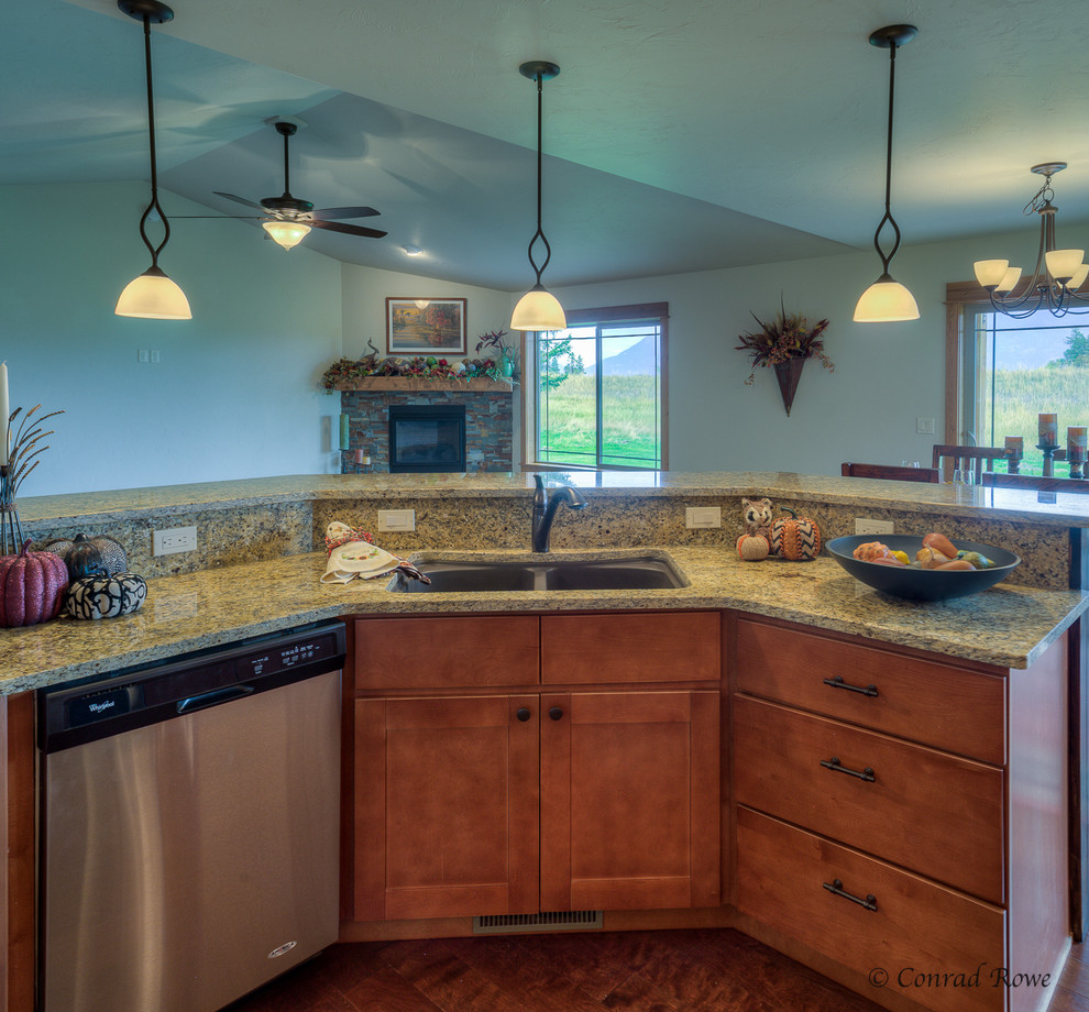 Eat-in kitchen - mid-sized rustic u-shaped medium tone wood floor eat-in kitchen idea with a double-bowl sink, recessed-panel cabinets, medium tone wood cabinets, granite countertops, multicolored backsplash, mosaic tile backsplash, stainless steel appliances and an island