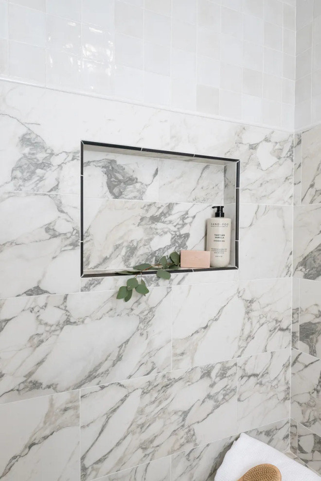 Example of a transitional master black tile and porcelain tile porcelain tile, white floor and double-sink freestanding bathtub design in Orange County with shaker cabinets, light wood cabinets, white walls, an undermount sink, quartz countertops, a hinged shower door, black countertops and a built-in vanity