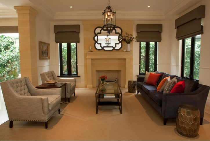 Design ideas for a large mediterranean formal enclosed living room in Melbourne with beige walls, carpet, a standard fireplace, a stone fireplace surround and no tv.