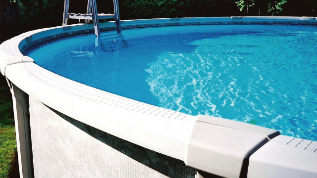 Example of a backyard round aboveground pool design