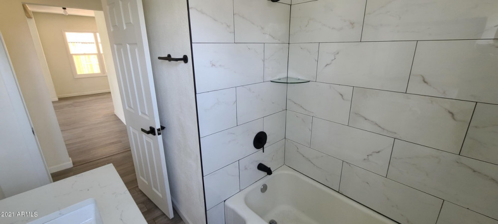 Inspiration for a small modern kids' white tile and ceramic tile ceramic tile, gray floor and single-sink bathroom remodel in Phoenix with shaker cabinets, white cabinets, a two-piece toilet, white walls, an undermount sink, quartz countertops, white countertops and a built-in vanity
