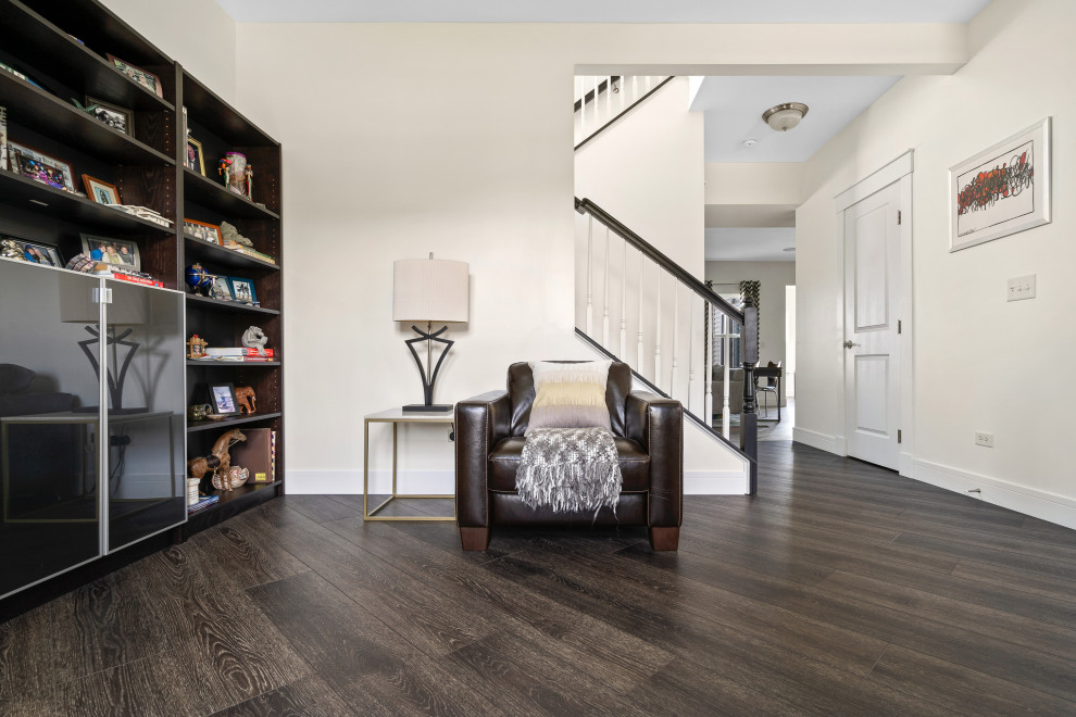 Large eclectic vinyl floor and gray floor family room photo in Chicago with multicolored walls