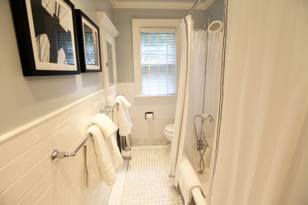 Photo of a mid-sized traditional kids bathroom in Boston with a claw-foot tub, blue walls, mosaic tile floors, white floor, white cabinets, white tile, marble benchtops, a shower curtain, white benchtops, a single vanity and a freestanding vanity.