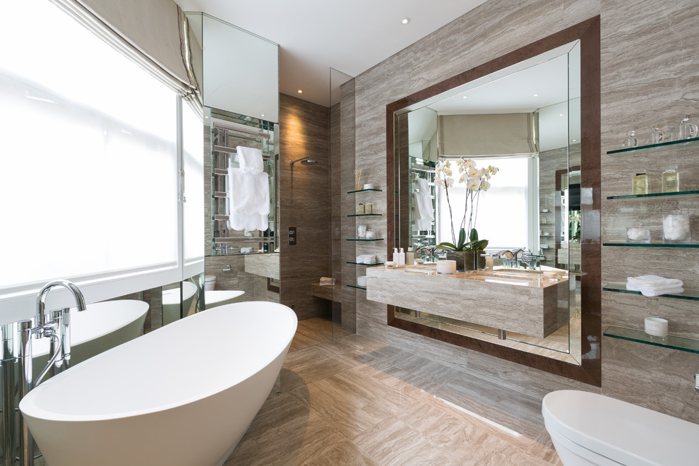 Contemporary master wet room bathroom in London with flat-panel cabinets, brown cabinets, a freestanding tub, brown tile, marble, brown walls, marble floors, an integrated sink, brown floor and an open shower.