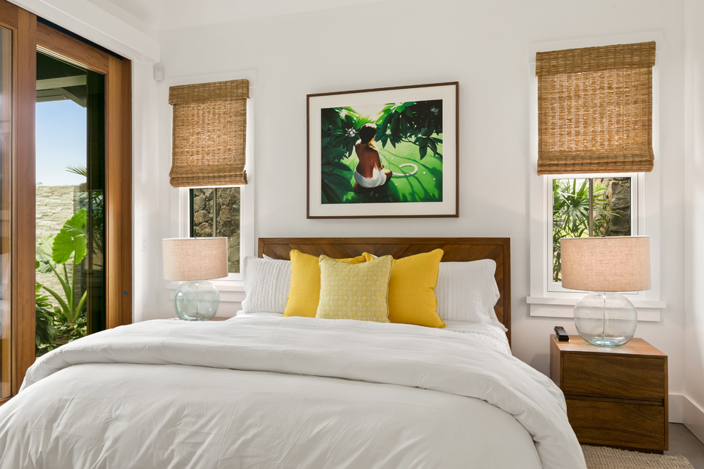 Mid-sized beach style guest bedroom in Hawaii with white walls, ceramic floors, no fireplace and grey floor.