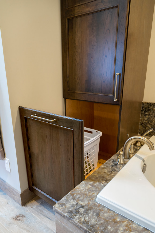 Large traditional master bathroom in Philadelphia with flat-panel cabinets, medium wood cabinets, a corner tub, an open shower, a two-piece toilet, gray tile, stone slab, beige walls, porcelain floors, an undermount sink, engineered quartz benchtops, beige floor, an open shower and white benchtops.