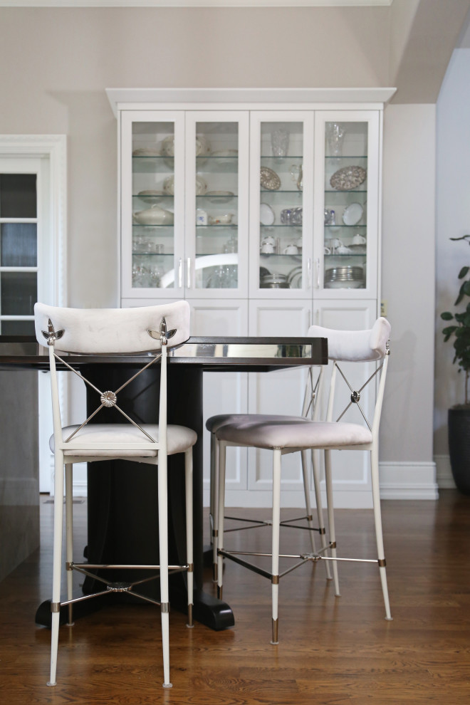 Inspiration for a huge transitional medium tone wood floor and brown floor eat-in kitchen remodel with an undermount sink, recessed-panel cabinets, white cabinets, quartzite countertops, white backsplash, ceramic backsplash, stainless steel appliances, an island and white countertops