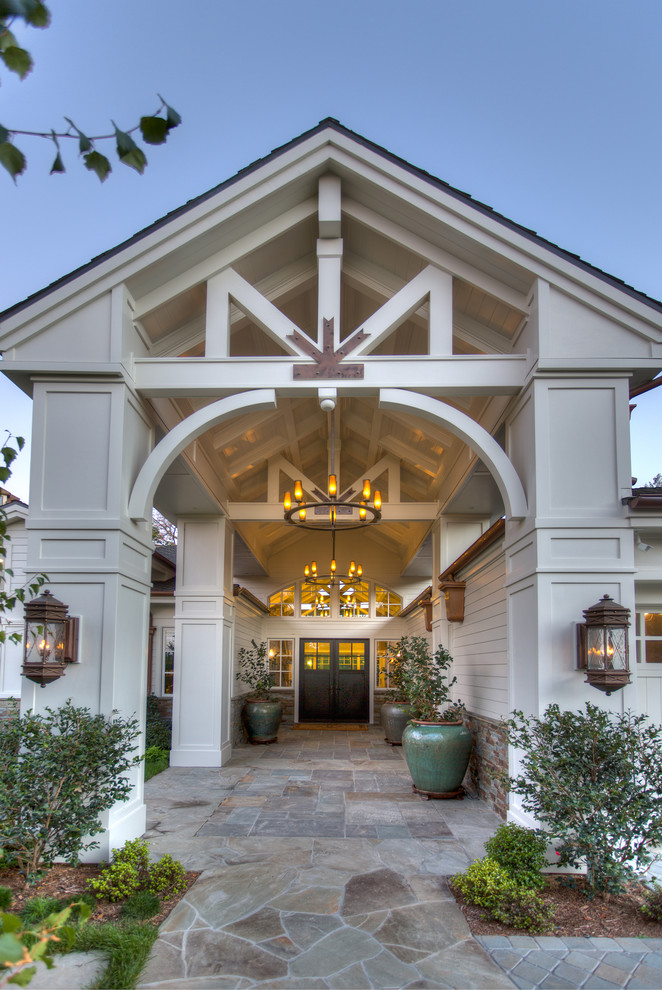 Large traditional front door in Orange County with a double front door, white walls and a black front door.