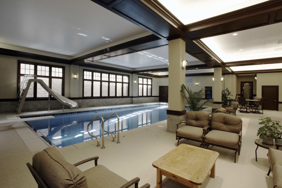 This is an example of a mid-sized contemporary indoor rectangular pool in Chicago with a hot tub.