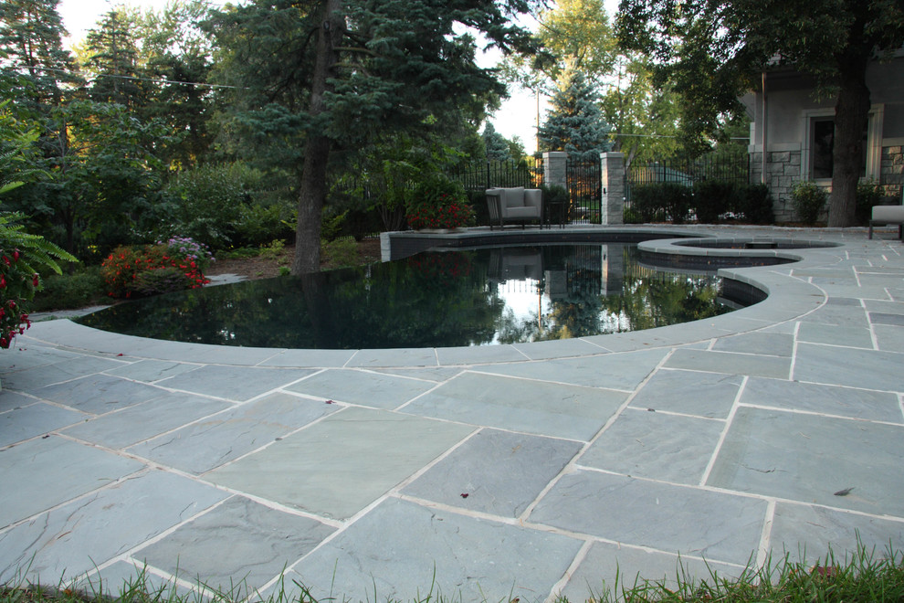 Inspiration for a contemporary pool remodel in Omaha