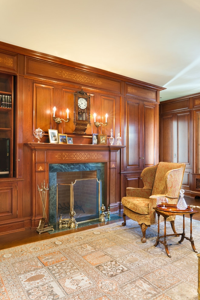 Inspiration for a traditional family room in New York with brown walls and medium hardwood floors.