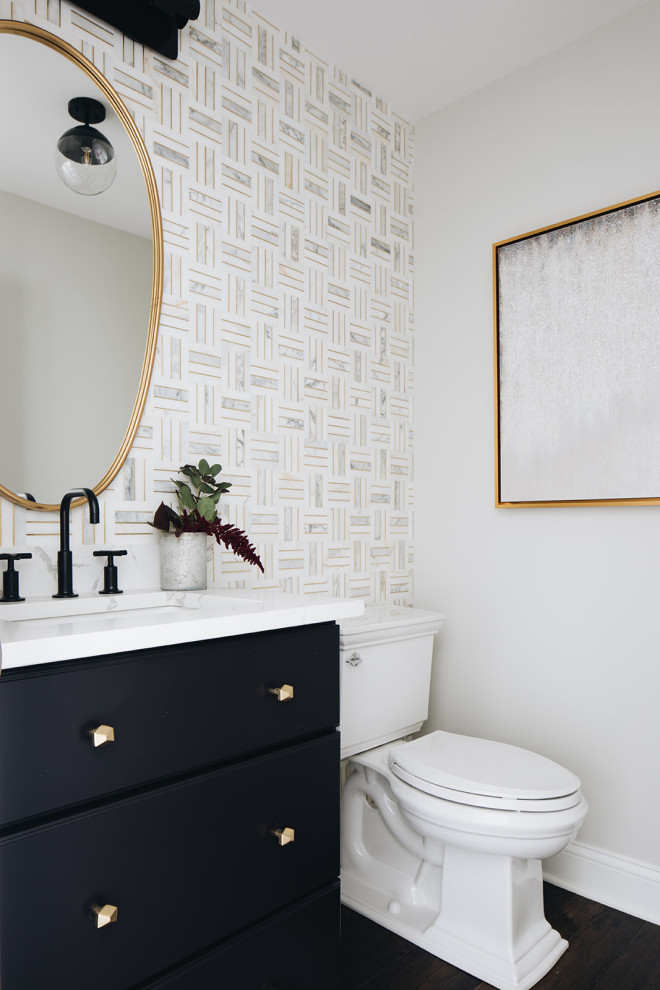 Inspiration for a small transitional bathroom in Chicago with flat-panel cabinets, black cabinets, a two-piece toilet, white tile, marble, grey walls, dark hardwood floors, an undermount sink, engineered quartz benchtops, brown floor and white benchtops.