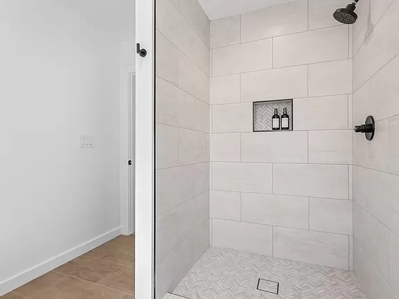 Inspiration for a transitional white tile bathroom remodel in Austin