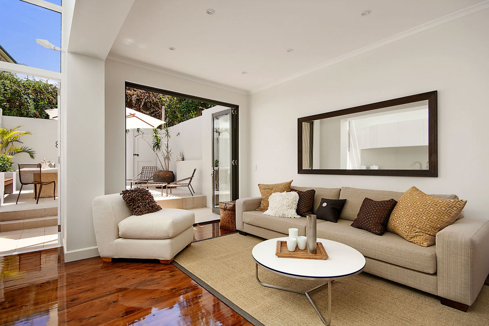 Contemporary living room in Sydney with white walls.