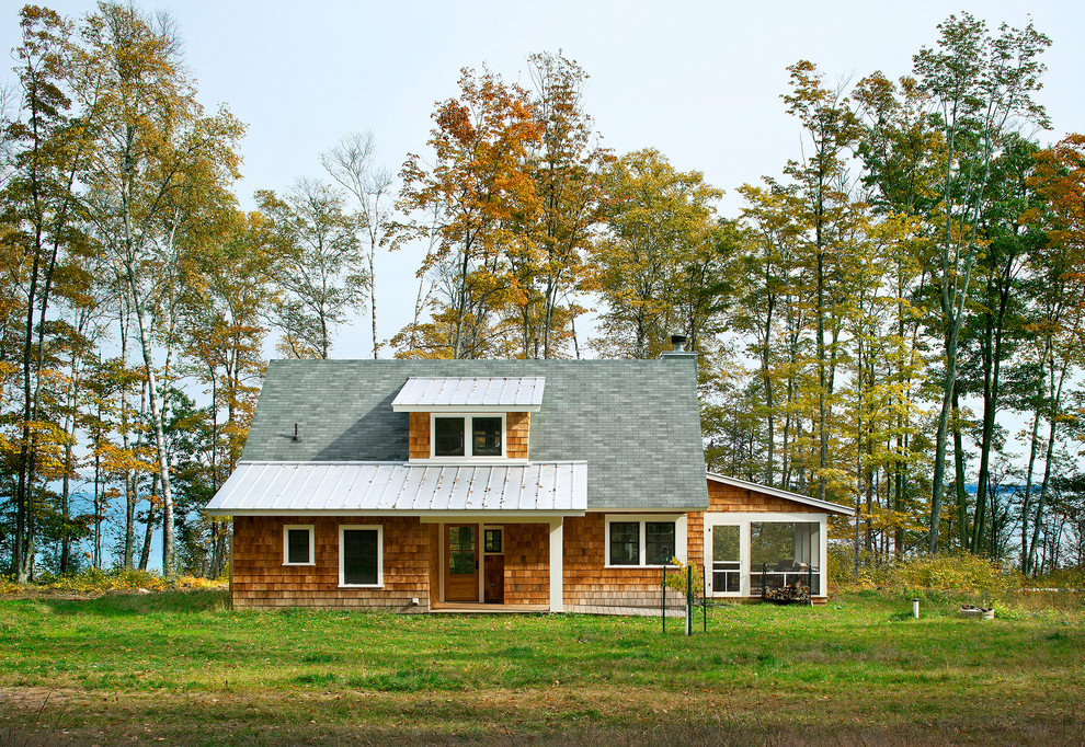Cottage beige two-story wood gable roof idea in Minneapolis with a mixed material roof