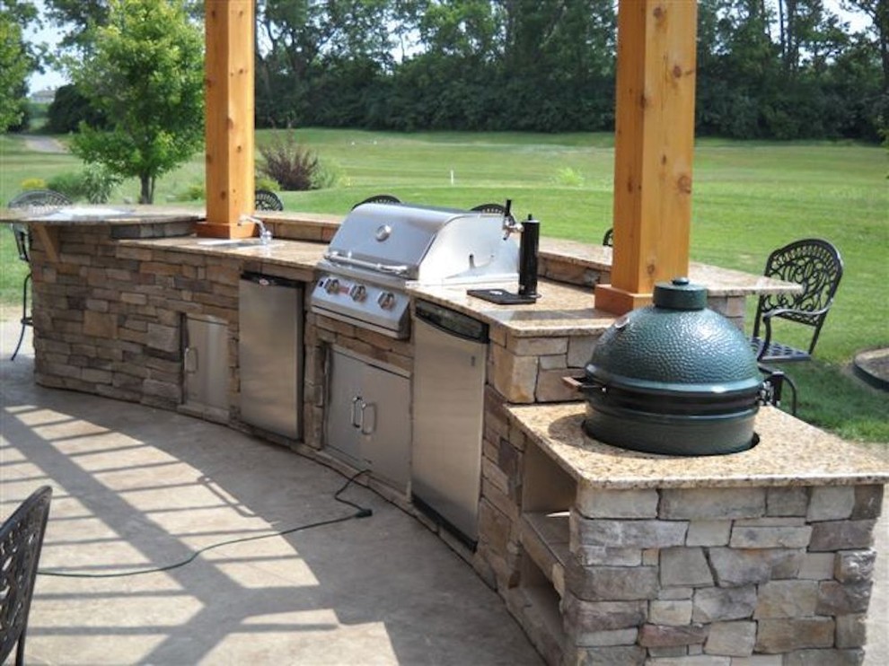 Patio kitchen - mid-sized transitional backyard patio kitchen idea with a pergola