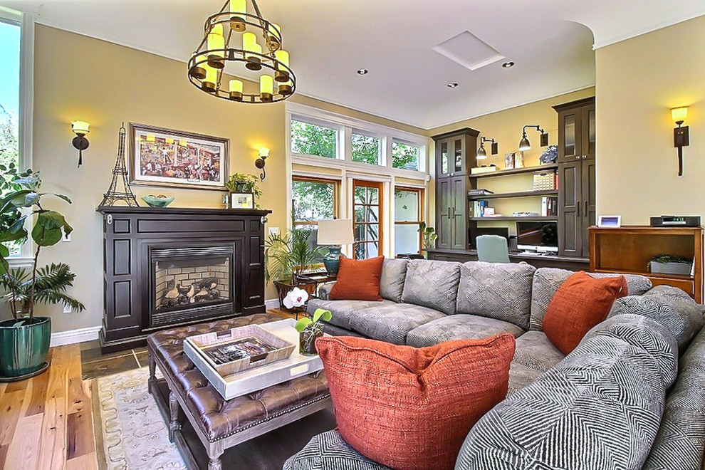 Photo of a mid-sized traditional formal open concept living room in Orange County with beige walls, slate floors, a standard fireplace, a wood fireplace surround and no tv.