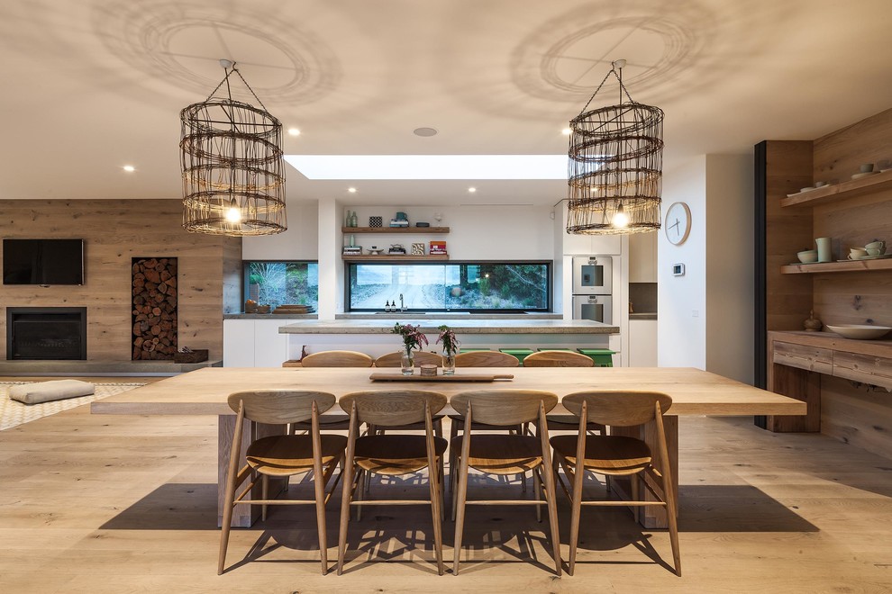 Inspiration for a large scandinavian open plan dining in Melbourne with light hardwood floors.