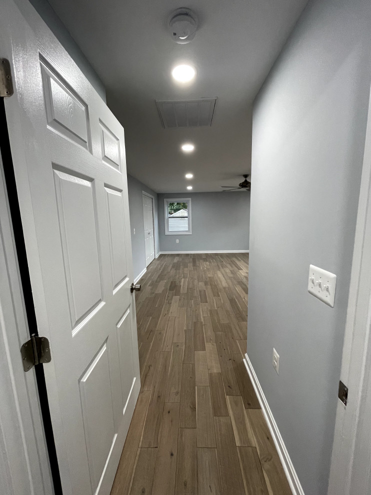 Example of a mid-sized transitional bedroom design in DC Metro