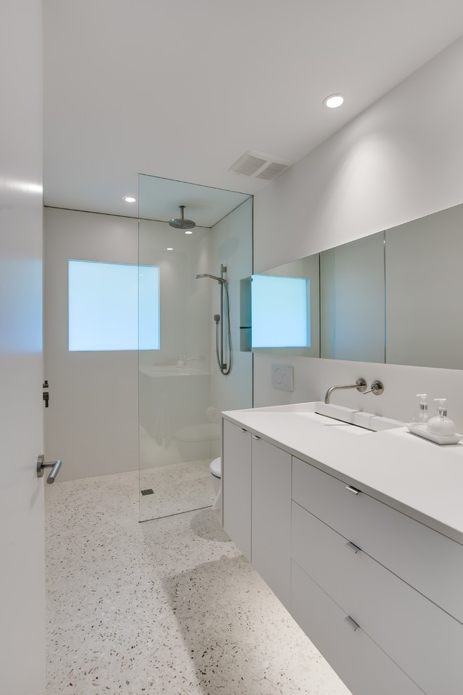 Inspiration for a modern bathroom in Tampa with an integrated sink, concrete benchtops, a curbless shower, white tile, cement tile, white walls and concrete floors.