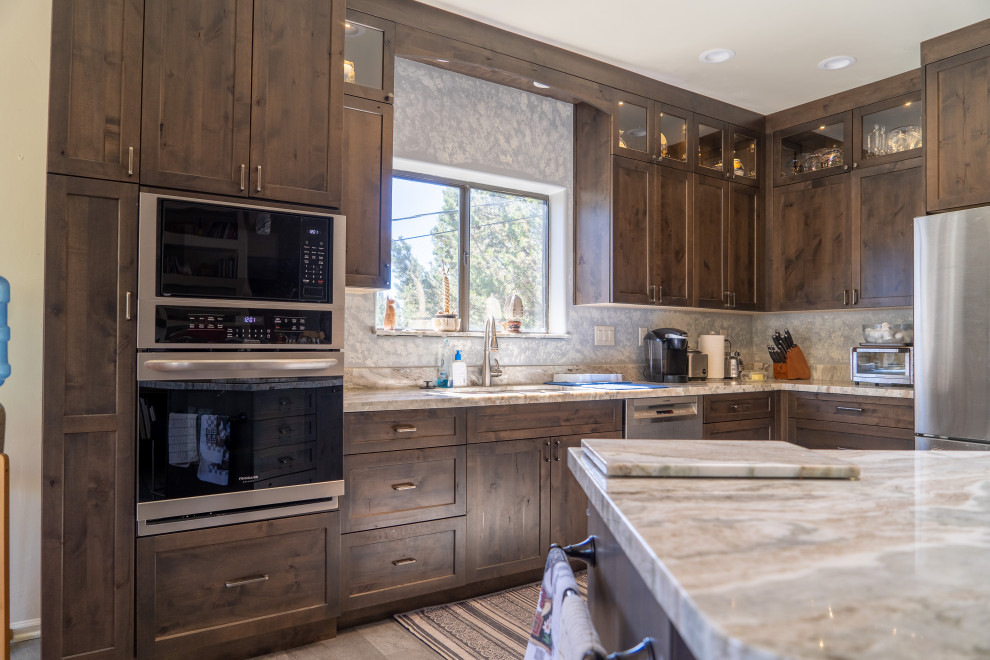 Inspiration for a transitional kitchen remodel with shaker cabinets, medium tone wood cabinets and an island