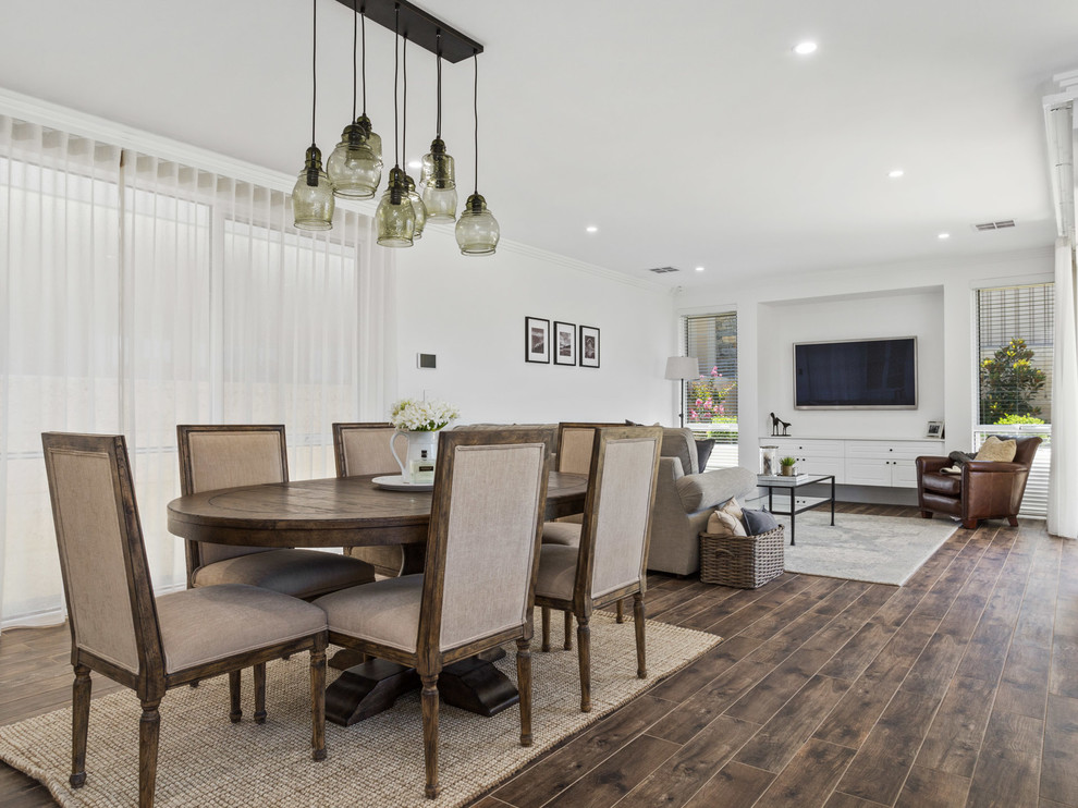 Inspiration for a transitional dining room in Perth with white walls and brown floor.