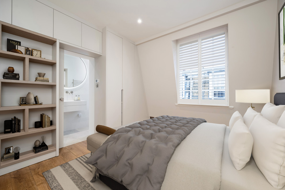 Medium sized contemporary bedroom in London.