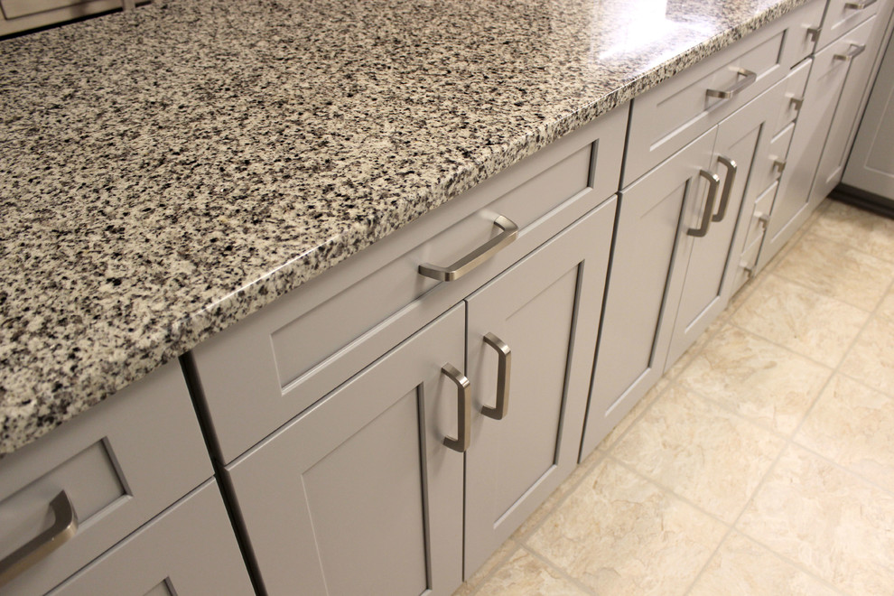 Grey Kitchen With White Subway Tile Backsplash And Granite