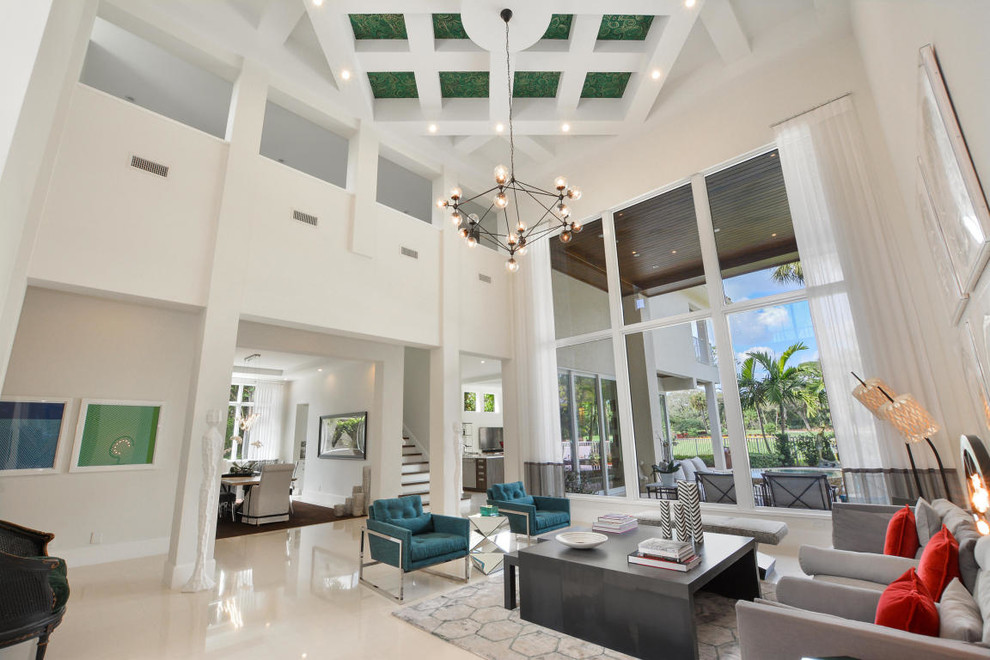 Inspiration for a large classic foyer in Miami with white walls.