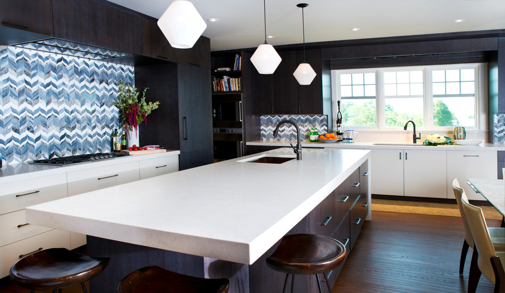 Photo of a contemporary eat-in kitchen in Boston with an undermount sink, flat-panel cabinets, multi-coloured splashback, dark hardwood floors and with island.