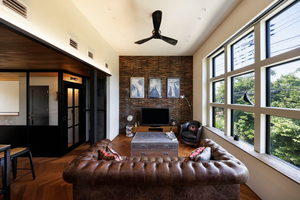 他の地域にあるインダストリアルスタイルのおしゃれなリビングの写真