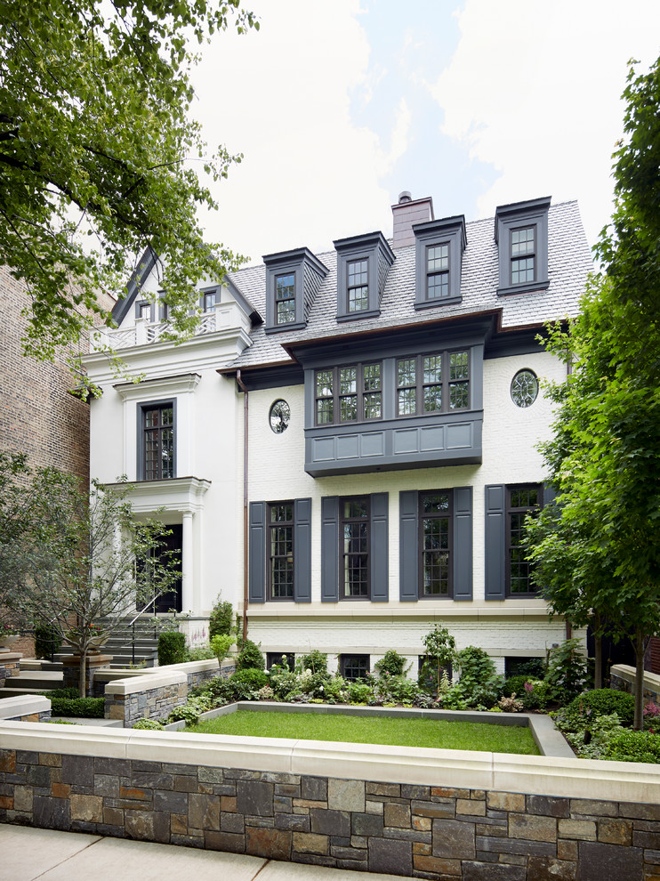 Inspiration for a timeless white three-story gable roof remodel in Chicago