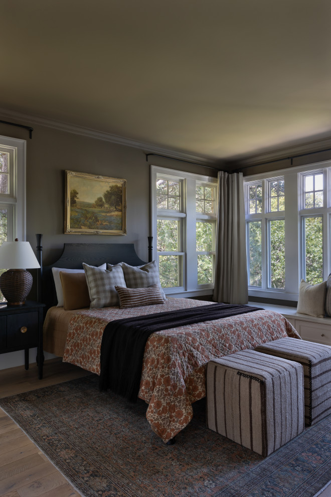 Bedroom - french country medium tone wood floor and brown floor bedroom idea in Austin with gray walls