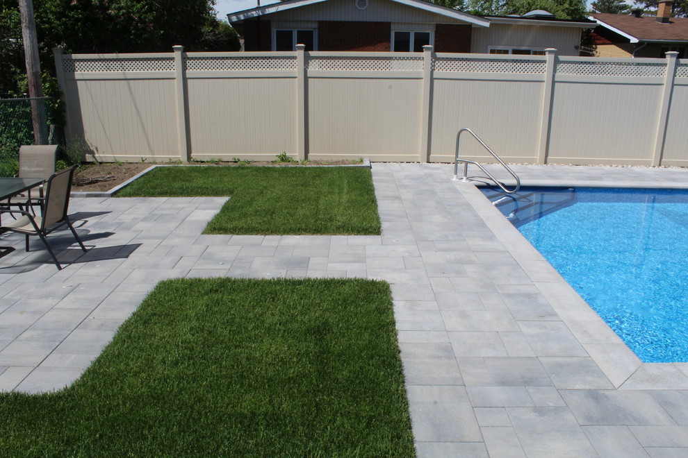 Mid-sized contemporary backyard full sun garden in Ottawa with brick pavers for summer.