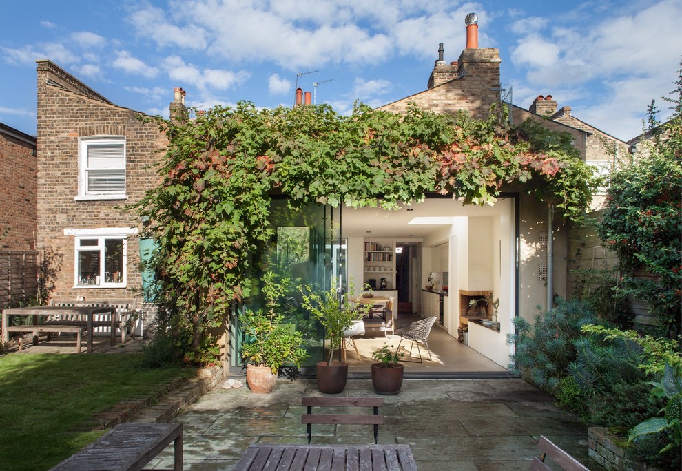Design ideas for a transitional brick exterior in London.