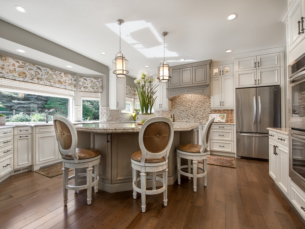 Inspiration for a large transitional u-shaped dark wood floor eat-in kitchen remodel in Denver with beaded inset cabinets, distressed cabinets, granite countertops, metallic backsplash, metal backsplash, stainless steel appliances and an island