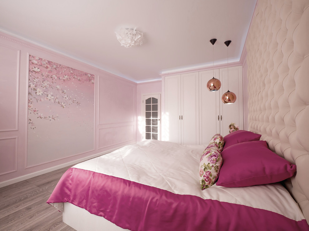 Mid-sized transitional master bedroom in Novosibirsk with pink walls, laminate floors and grey floor.
