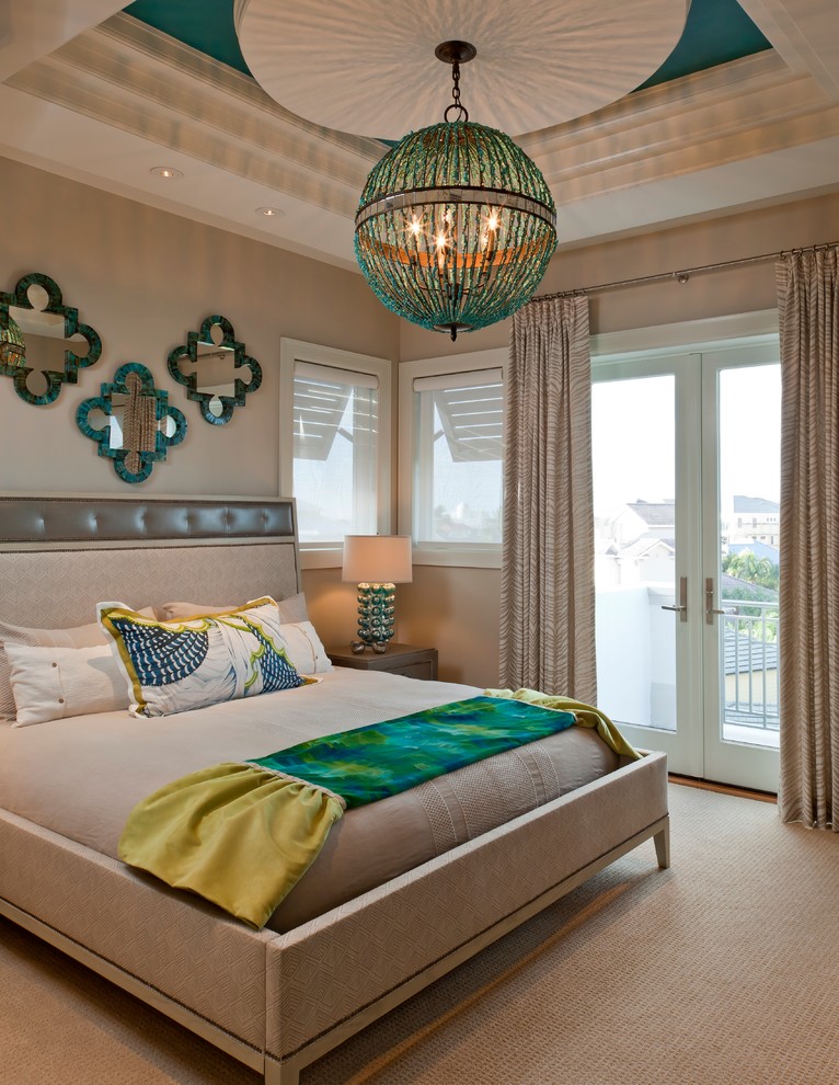 This is an example of a contemporary bedroom in Miami with beige walls, carpet and beige floor.