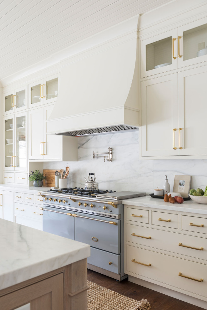 Transitional dark wood floor, brown floor and shiplap ceiling kitchen photo with beaded inset cabinets, white cabinets, white backsplash, stone slab backsplash, colored appliances, an island and white countertops