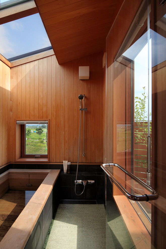 Photo of an asian master bathroom in Tokyo with a corner tub, an open shower, brown walls and an open shower.