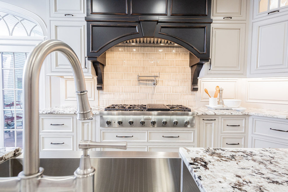 Kitchen - large transitional porcelain tile and beige floor kitchen idea with a farmhouse sink, beaded inset cabinets, gray cabinets, granite countertops, porcelain backsplash, stainless steel appliances, an island and beige countertops